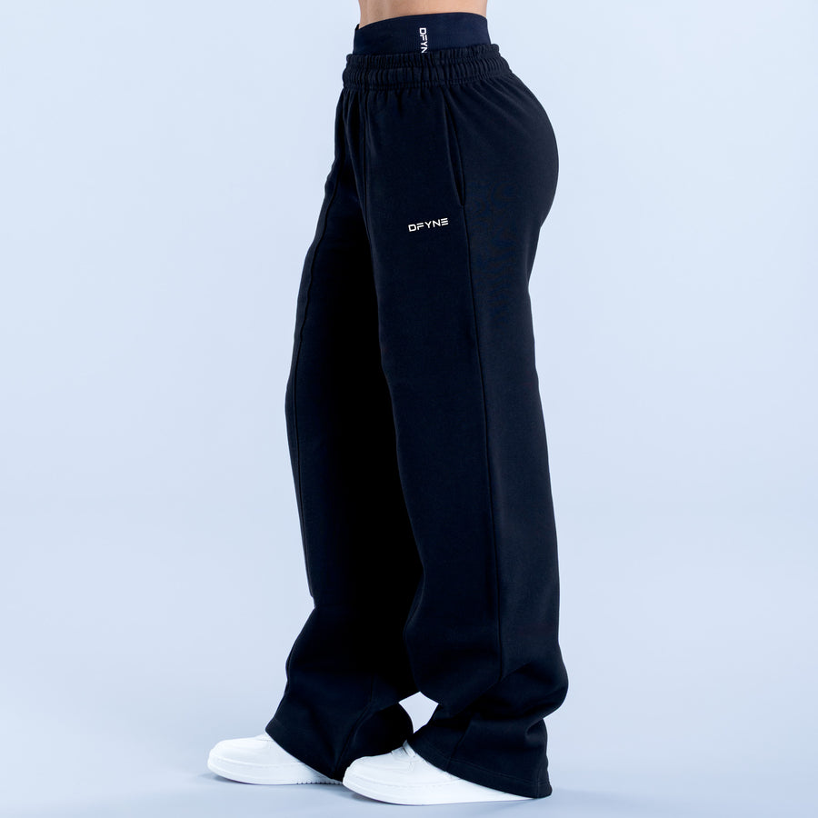 Wide leg jogger pants with elastic waistband and DYNS logo on thigh, dark