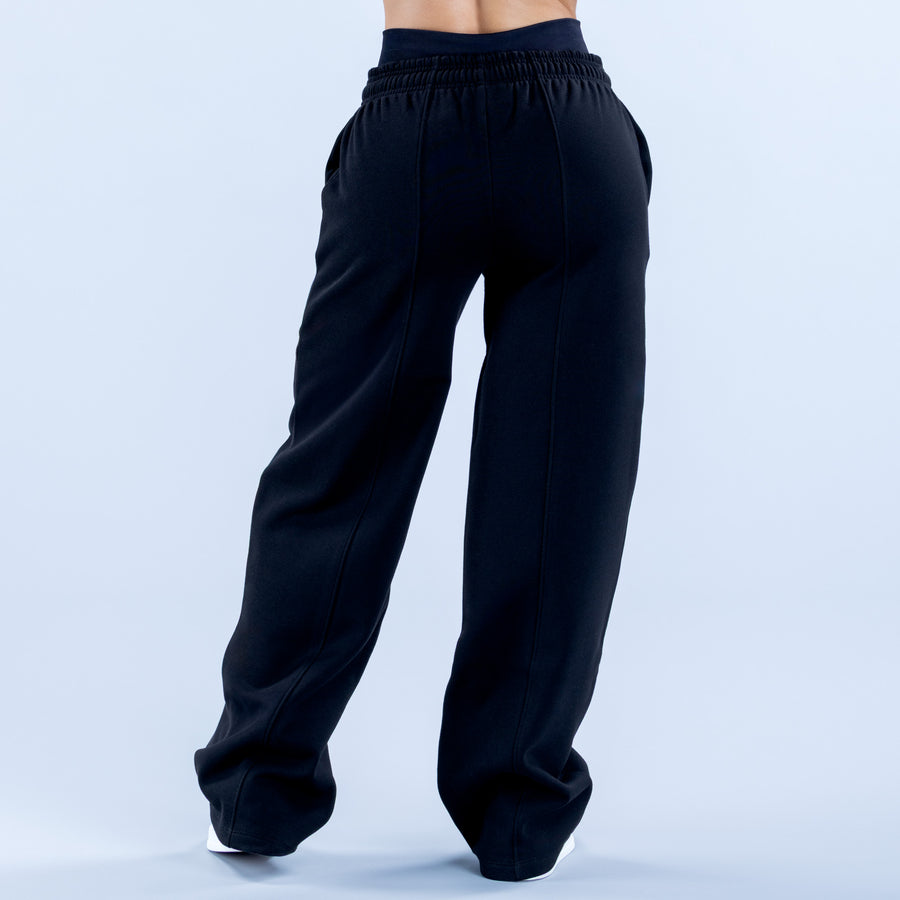 Wide leg jogger pants, dark; relaxed drape with elastic cuffs at ankles