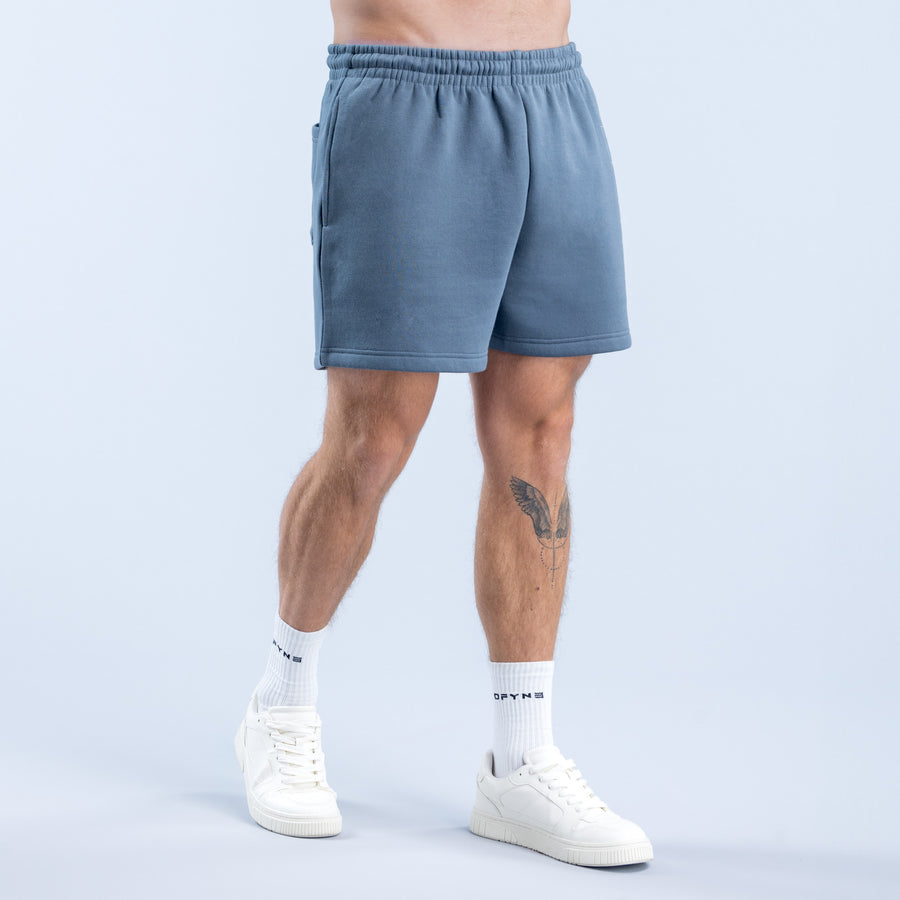 Slate blue graphic shorts, side view with elastic waistband