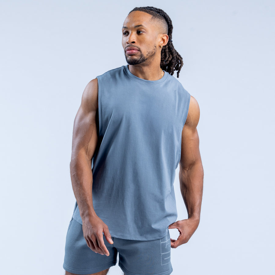 Blue sleeveless crew neck tank top, plain front with relaxed fit