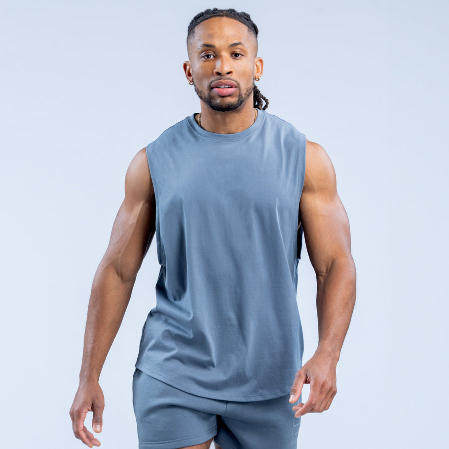 Blue sleeveless crew neck tank top with smooth fabric and straight hem