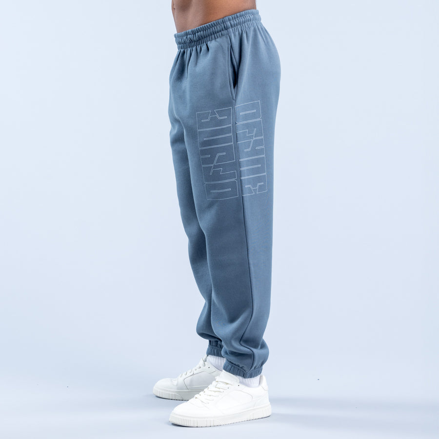 Blue graphic jogger pants with elastic waistband, side pocket, and ribbed ankle cuffs