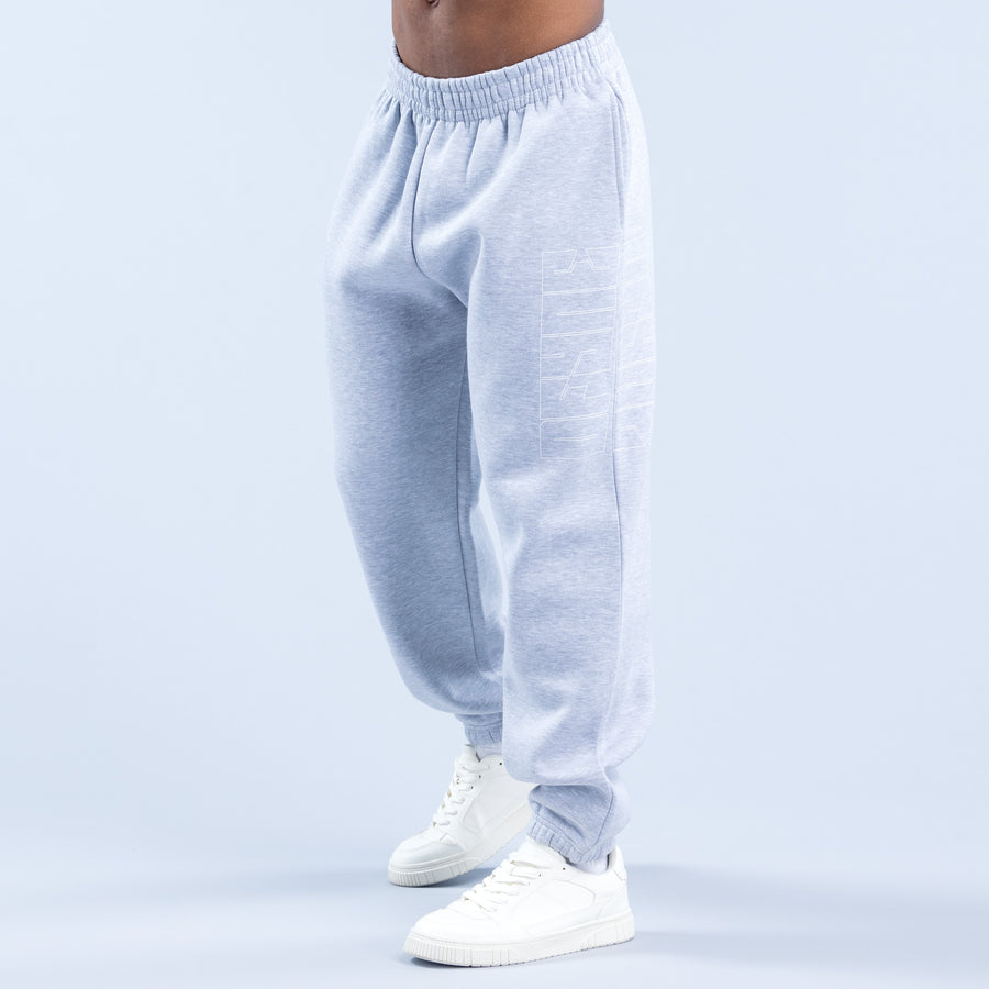 Light blue joggers with elastic waistband and subtle side graphic, tapered fit