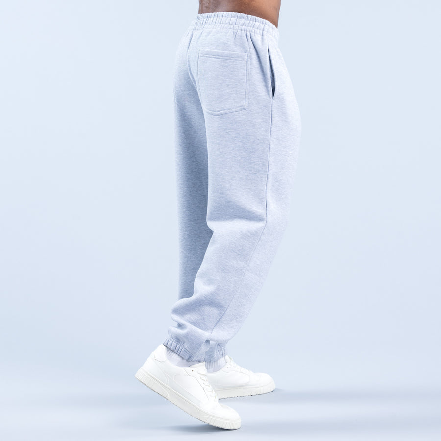 Light blue joggers with elastic waistband, side pockets, and tapered leg