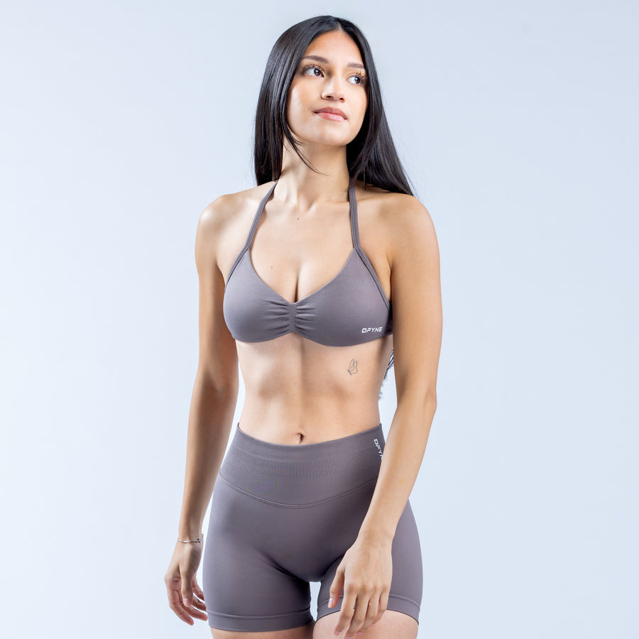 Gray strappy sports bra with twist front and thin halter straps