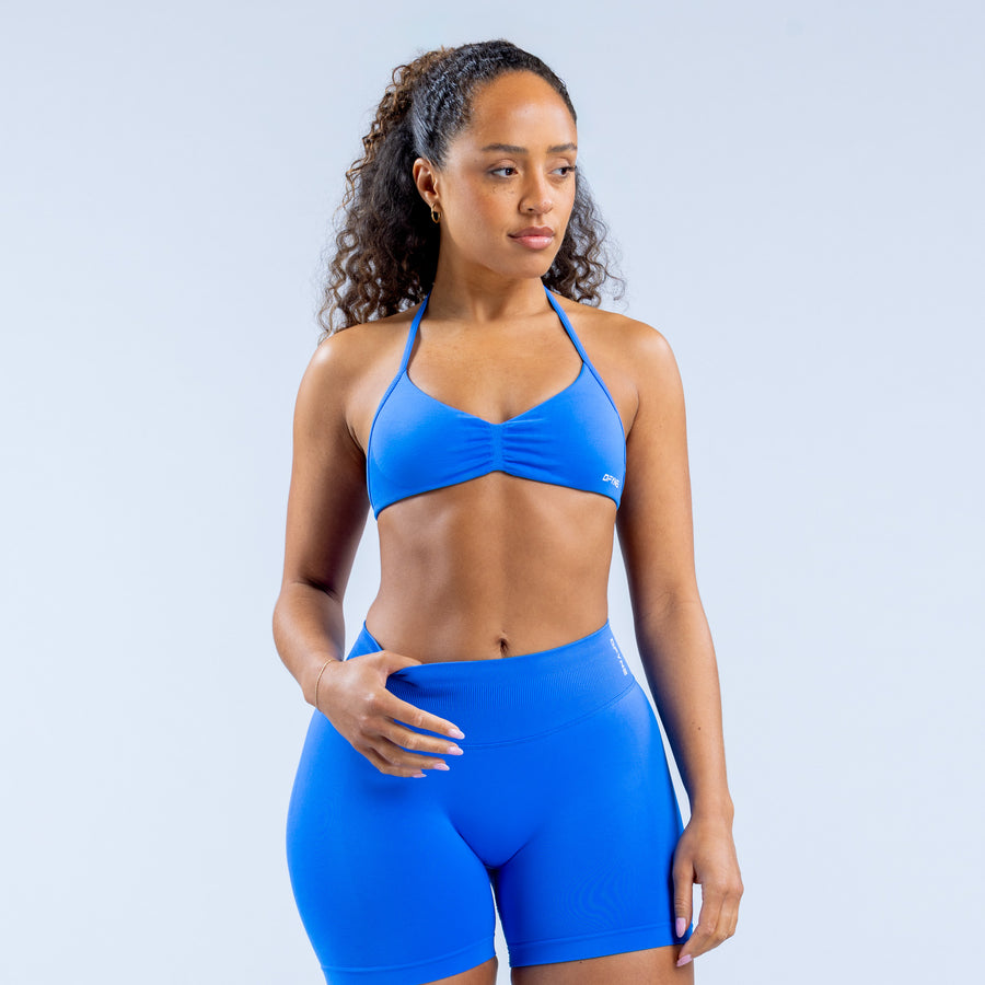 Impact strappy sports bra in bright blue with triangle cups and thin straps