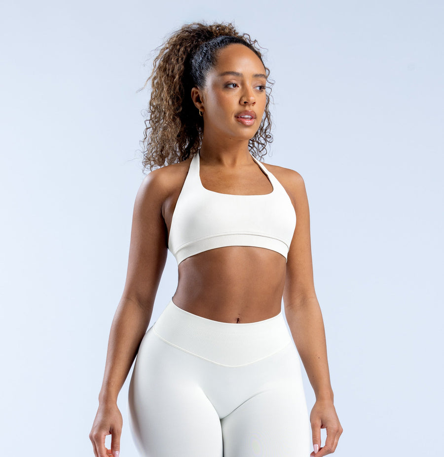 White impact sports bra front view with smooth cropped fit