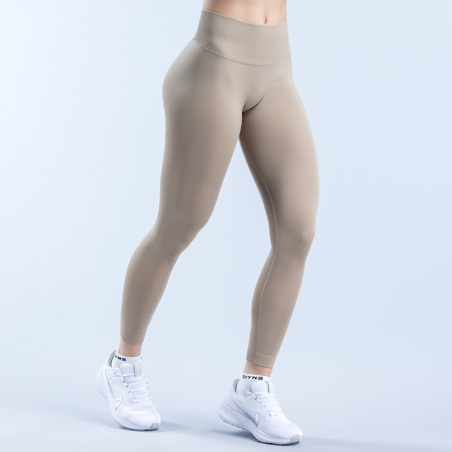 Taupe leggings with high-rise waistband and smooth contour seams