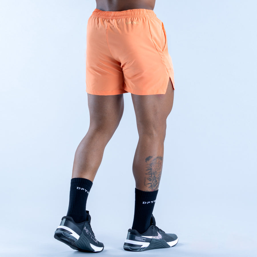 Peach orange training shorts back view with elastic waistband