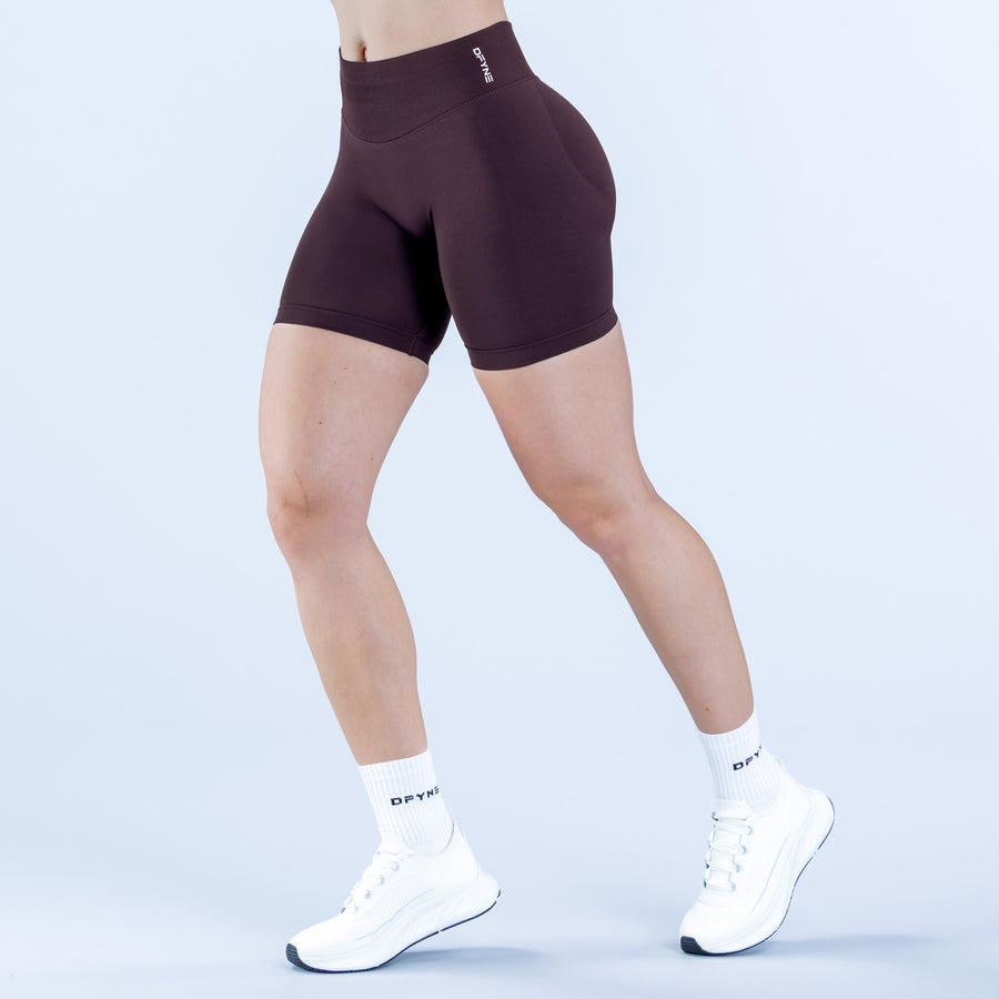 Impact shorts 6.5-inch, dark plum stretch with wide waistband and logo