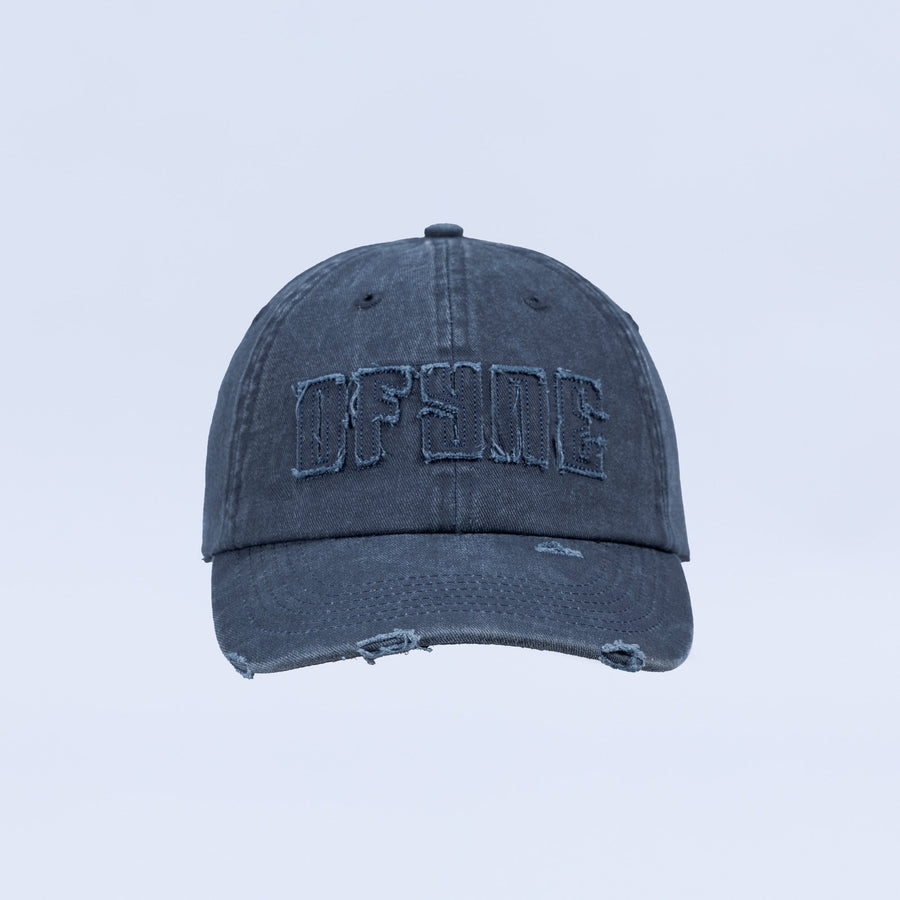 Distressed denim baseball cap with embroidered logo and frayed brim