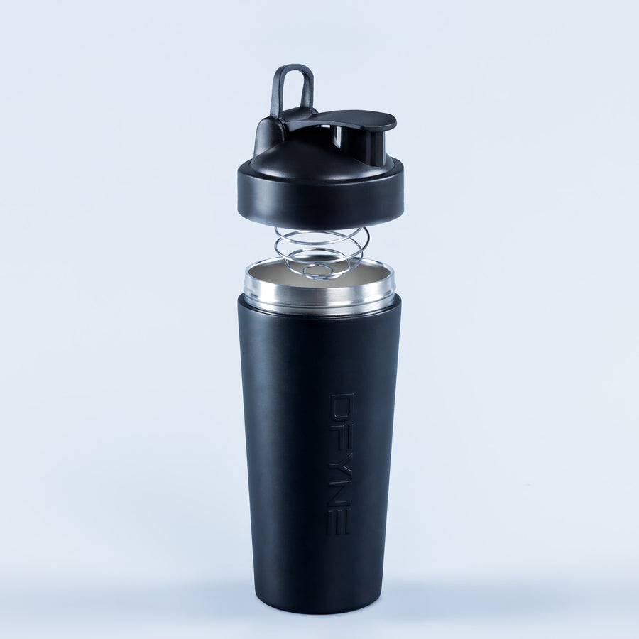 Shaker bottle with black lid and metal spring, front view