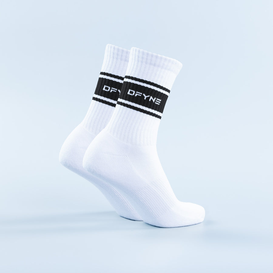 White crew socks with black stripe band and DFYNE logo detail on cuff
