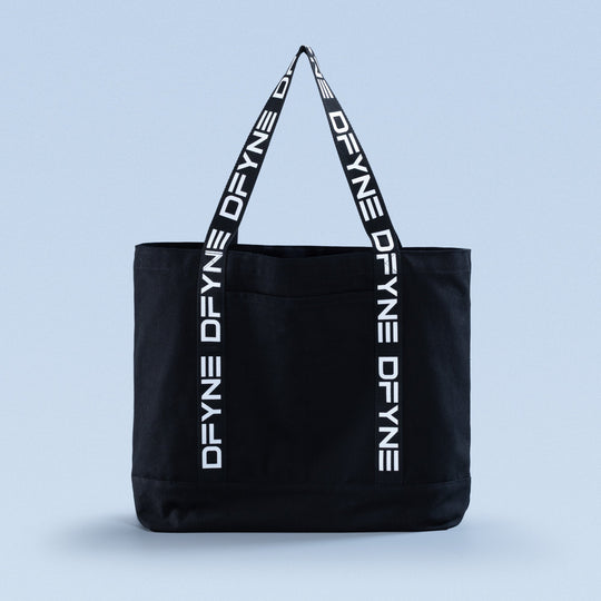 Black tote bag with top handles and vertical logo print straps