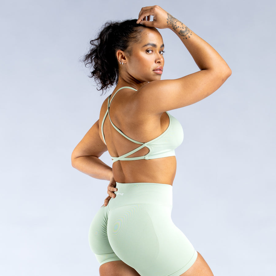 Mint backless sports bra with cross-back straps and straight neckline