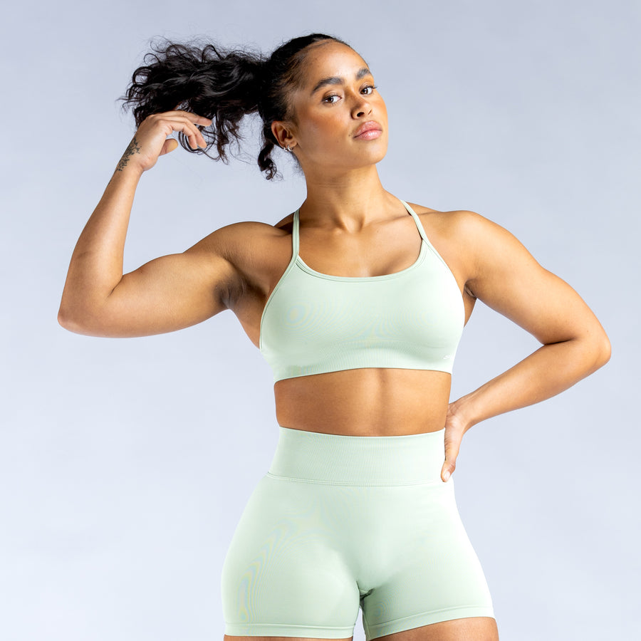 Mint backless sports bra with crisscross straps and supportive under-bust band