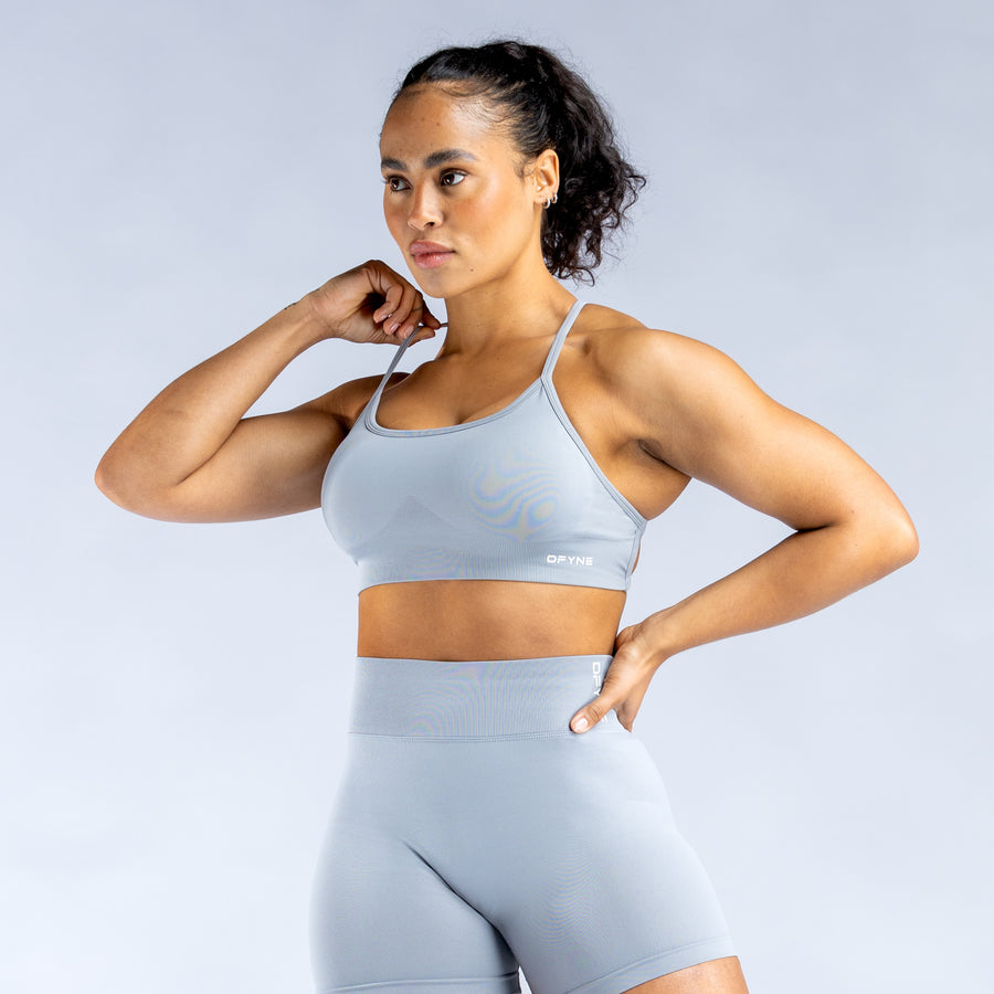 Light blue sports bra with crisscross back straps and scoop front