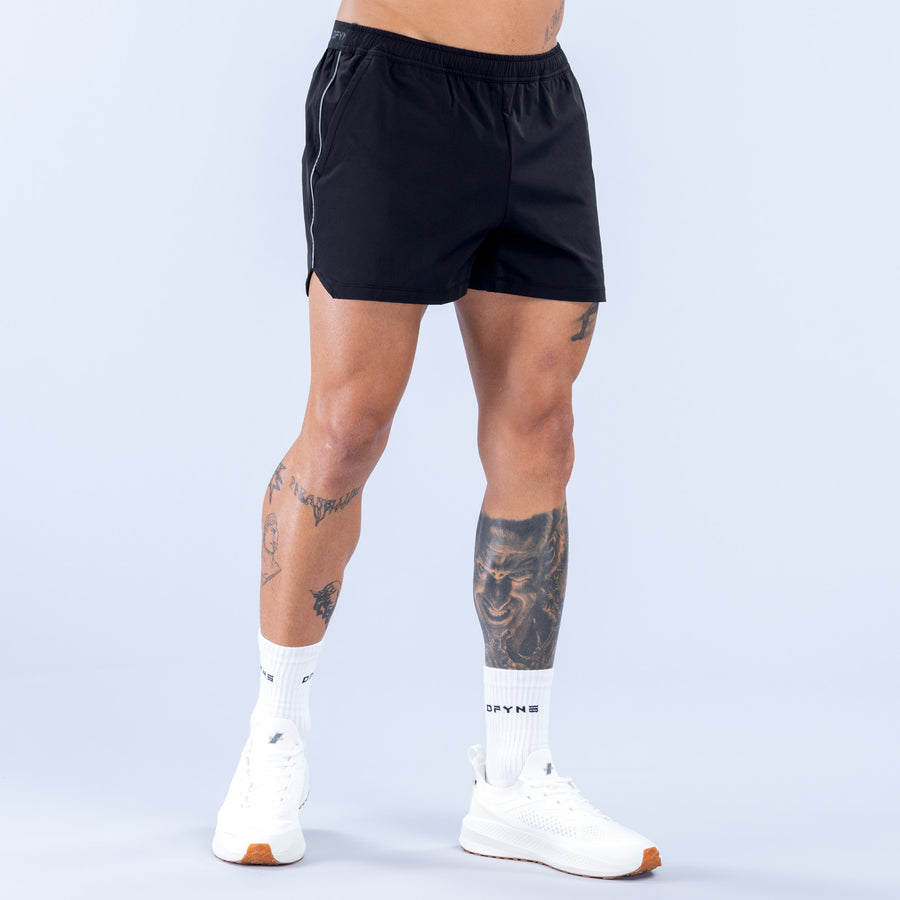 Black 4-inch training shorts with contrast side stripe and straight hem