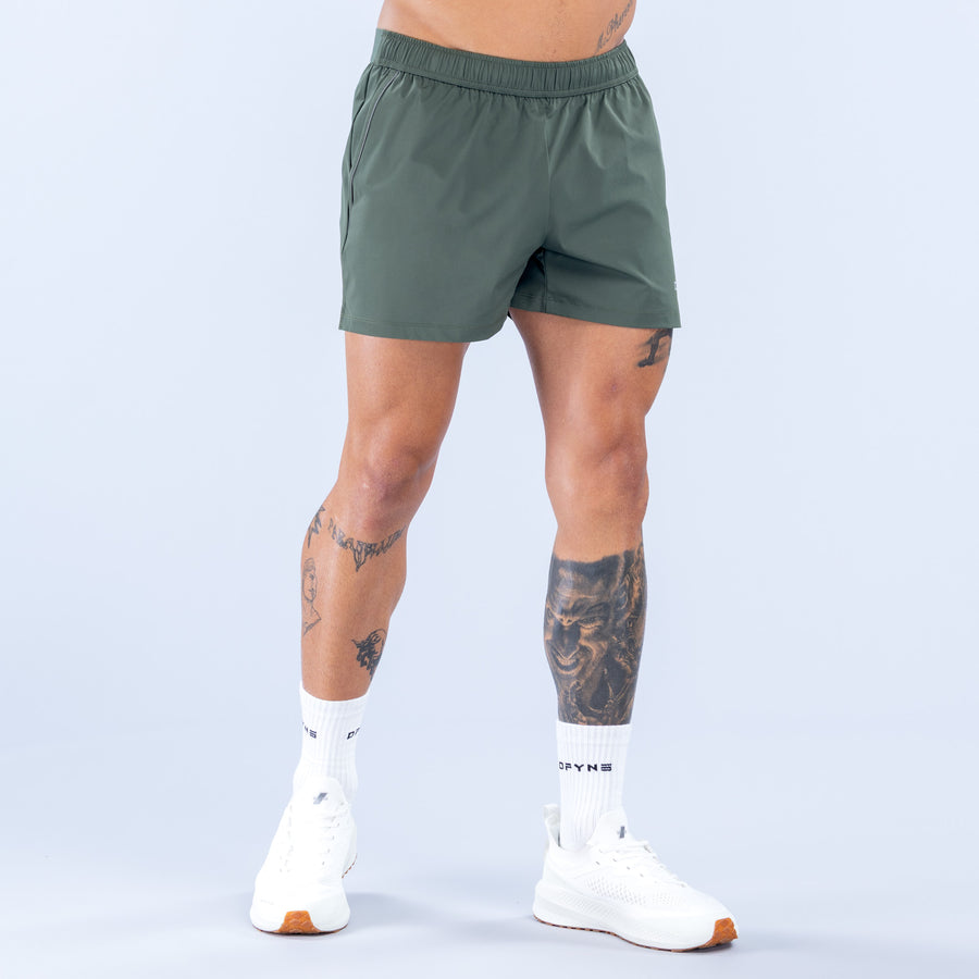 Dark green 4-inch training shorts, elastic waistband, relaxed fit