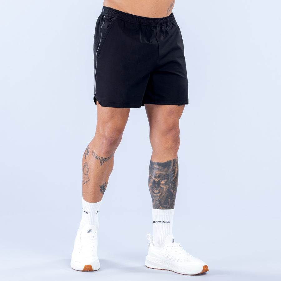6" training shorts in dark black with elastic waistband, side stripe, and straight hem