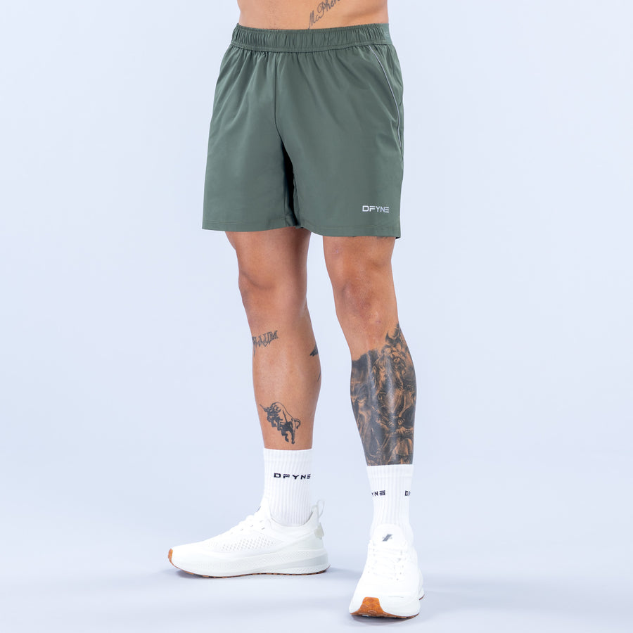 Training shorts for men, dark green, elastic waistband, 6" inseam, side logo