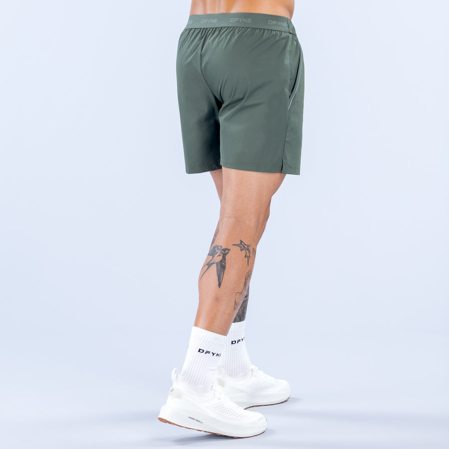 Training shorts for men, dark green, back view, elastic waistband, lightweight fabric