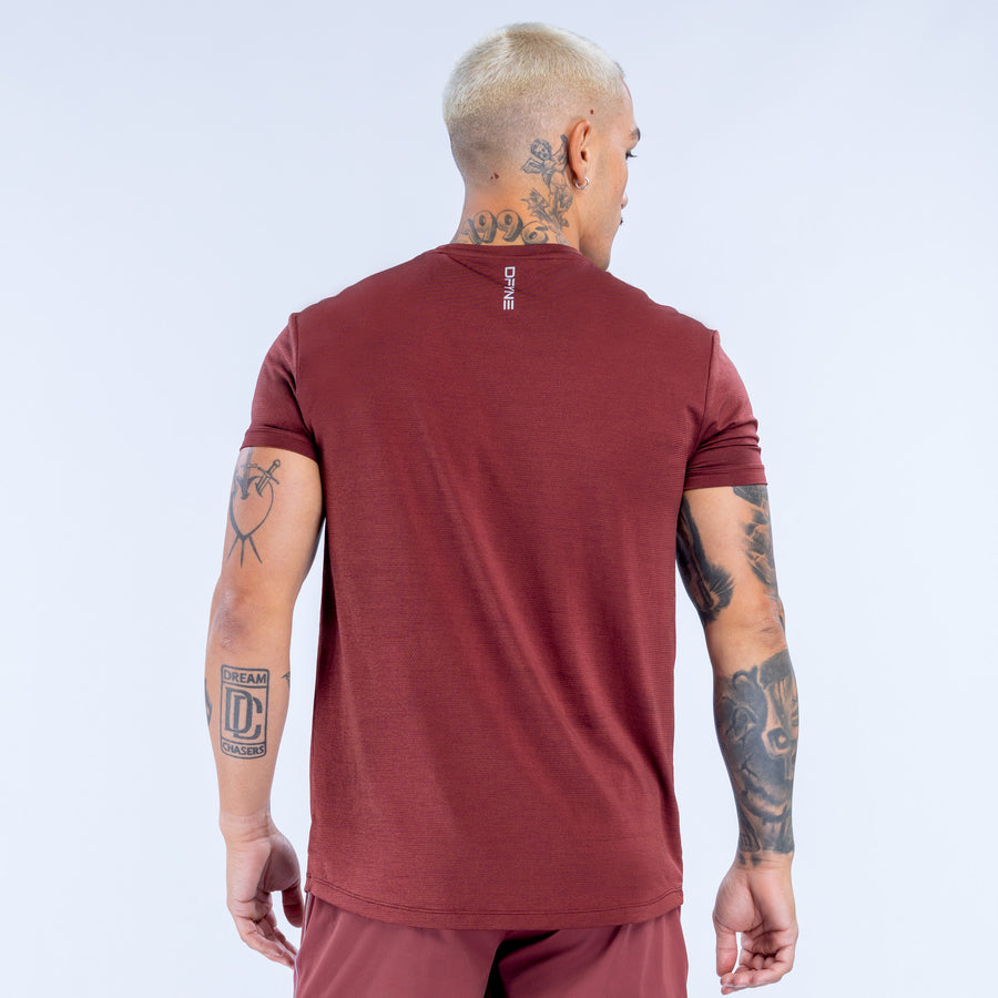 Burgundy athletic crewneck top, back view, with short raglan sleeves and seams