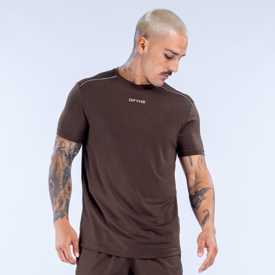 Dark brown active crewneck short-sleeve top with small chest logo and straight hem