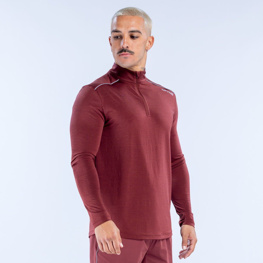 Maroon quarter-zip long-sleeve performance top with zip neck and flat seams