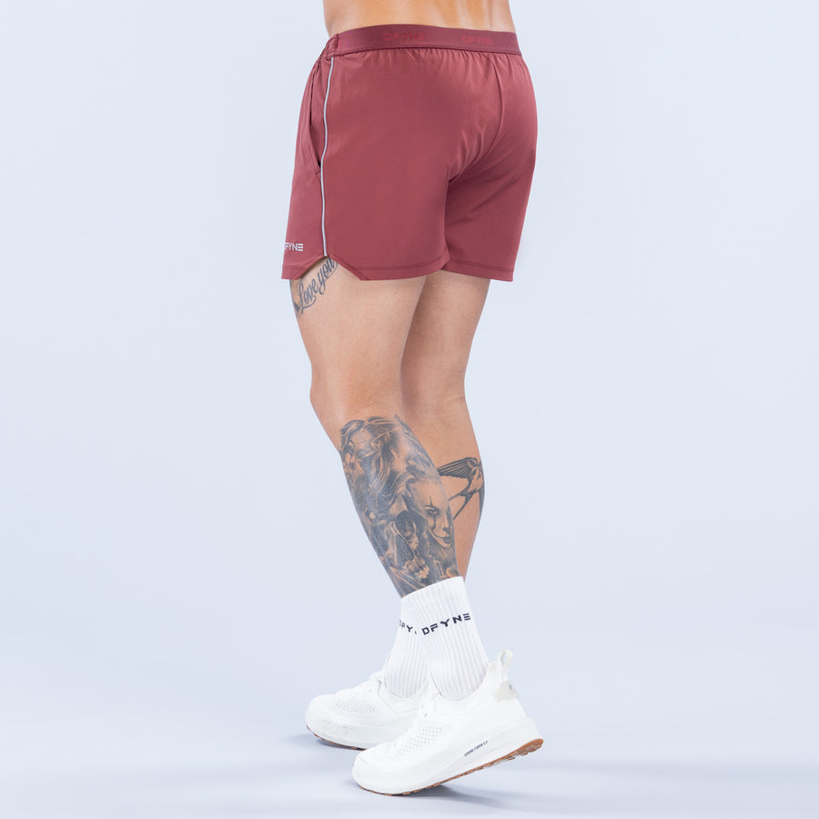 Burgundy 4-inch training shorts with elastic waist, drawcord, and logo on back hem