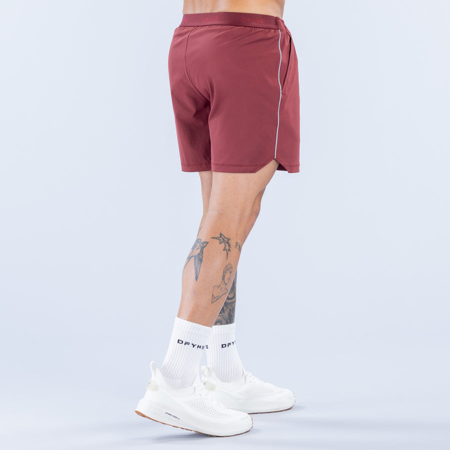 Burgundy training shorts with rear seam detail and logo, 6" inseam