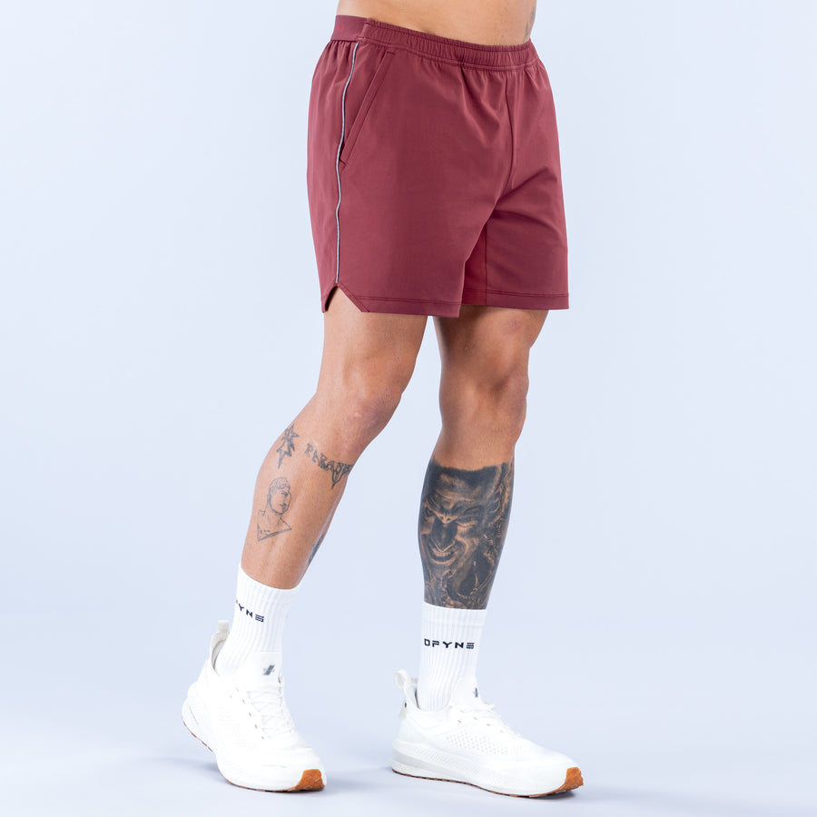 Burgundy training shorts with side seam detail and logo, 6" inseam