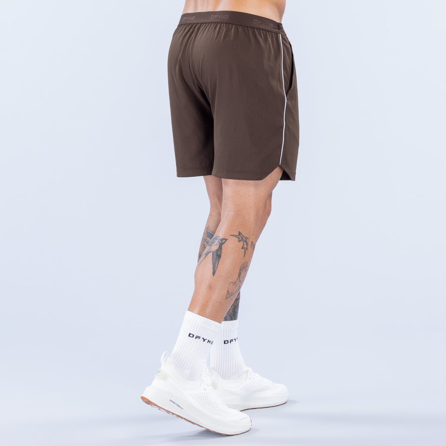 Brown training shorts back view, elastic waistband, side logo stripe, 6" inseam
