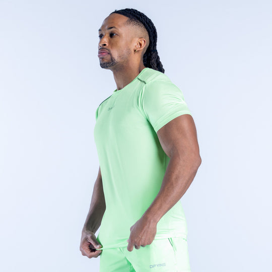 Light green active top with short sleeves and crew neck, side view