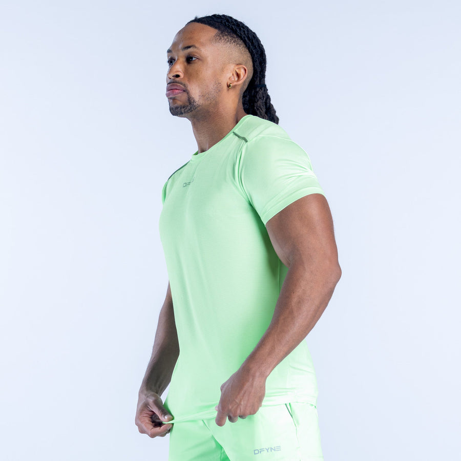 Light green active top with short sleeves and crew neck, side view
