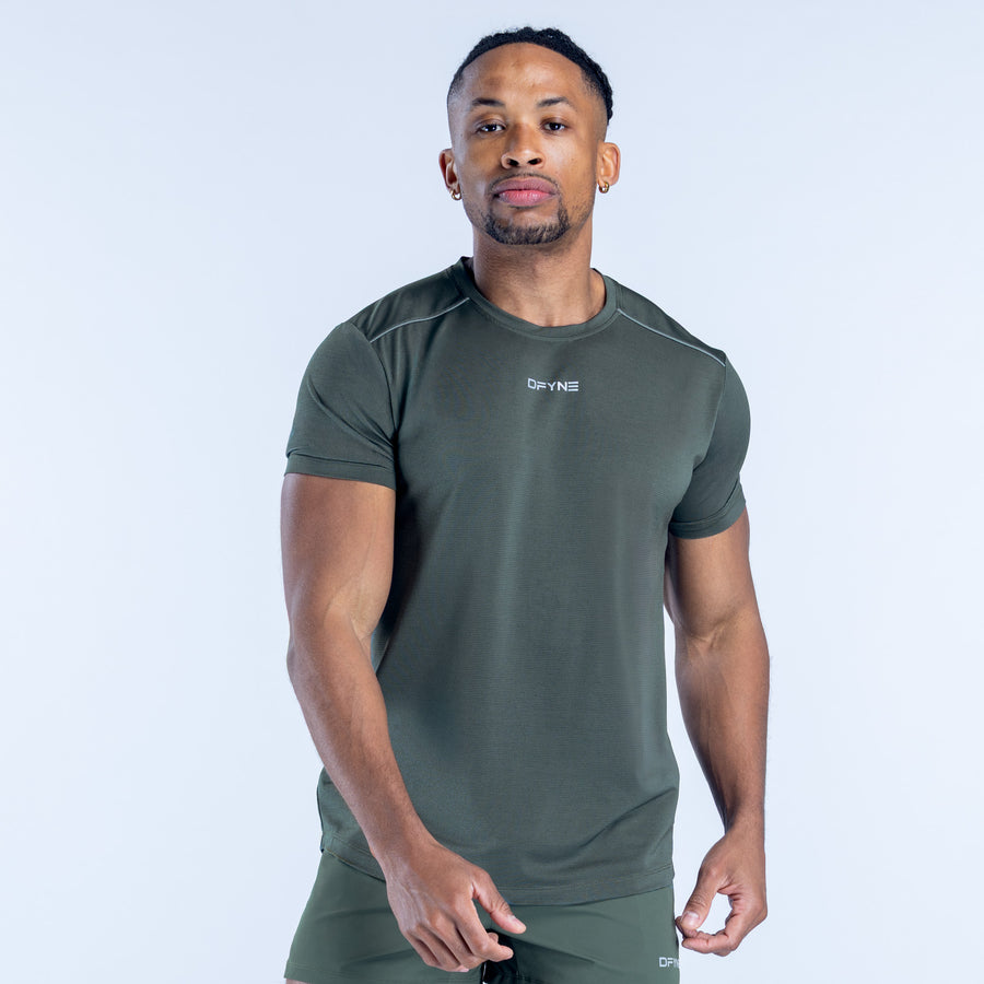 Men's dark green athletic short-sleeve top with chest logo detail