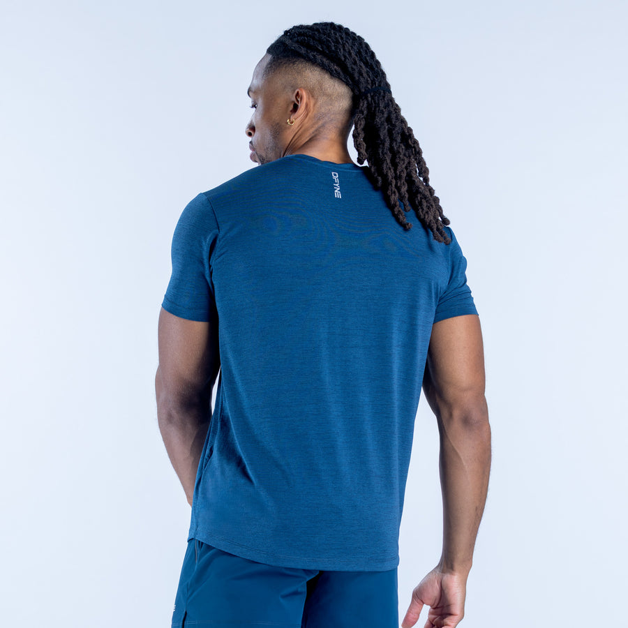 Blue crewneck short-sleeve active top, back view with small logo label.