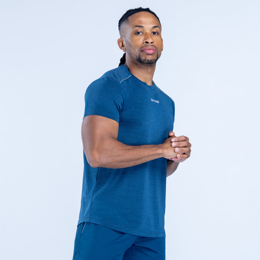 Blue crewneck short-sleeve active top with small chest logo.