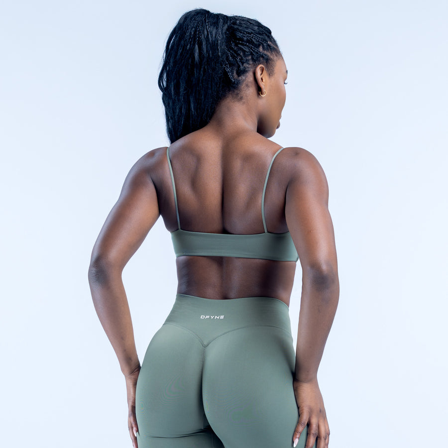 Back view of sage green strappy bra with thin open-back straps