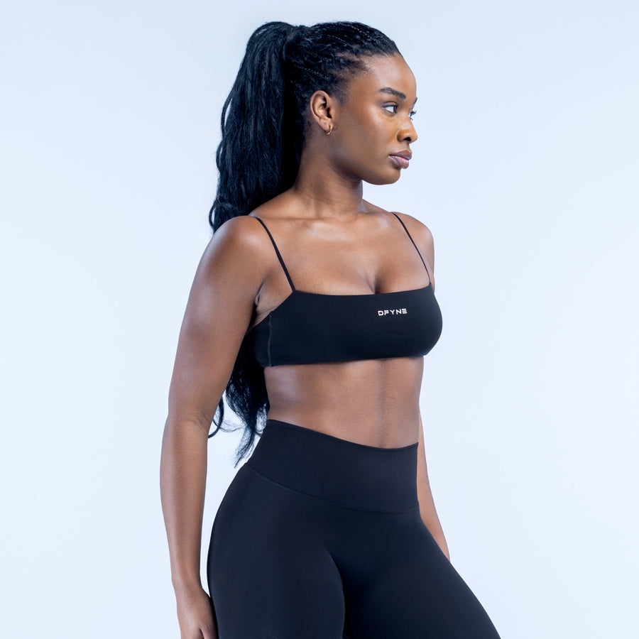 Black strappy bra with scoop neckline, thin adjustable straps, and fitted underband