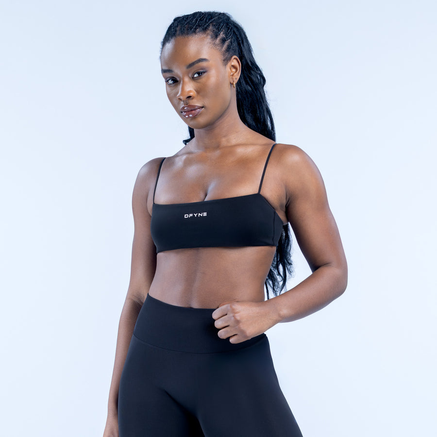 Black strappy bra with square neckline, thin straps, and small logo at center
