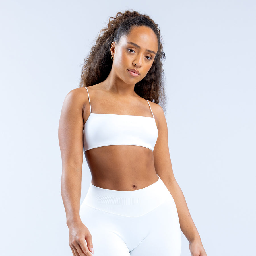 White strappy bra with thin straps and smooth molded cups