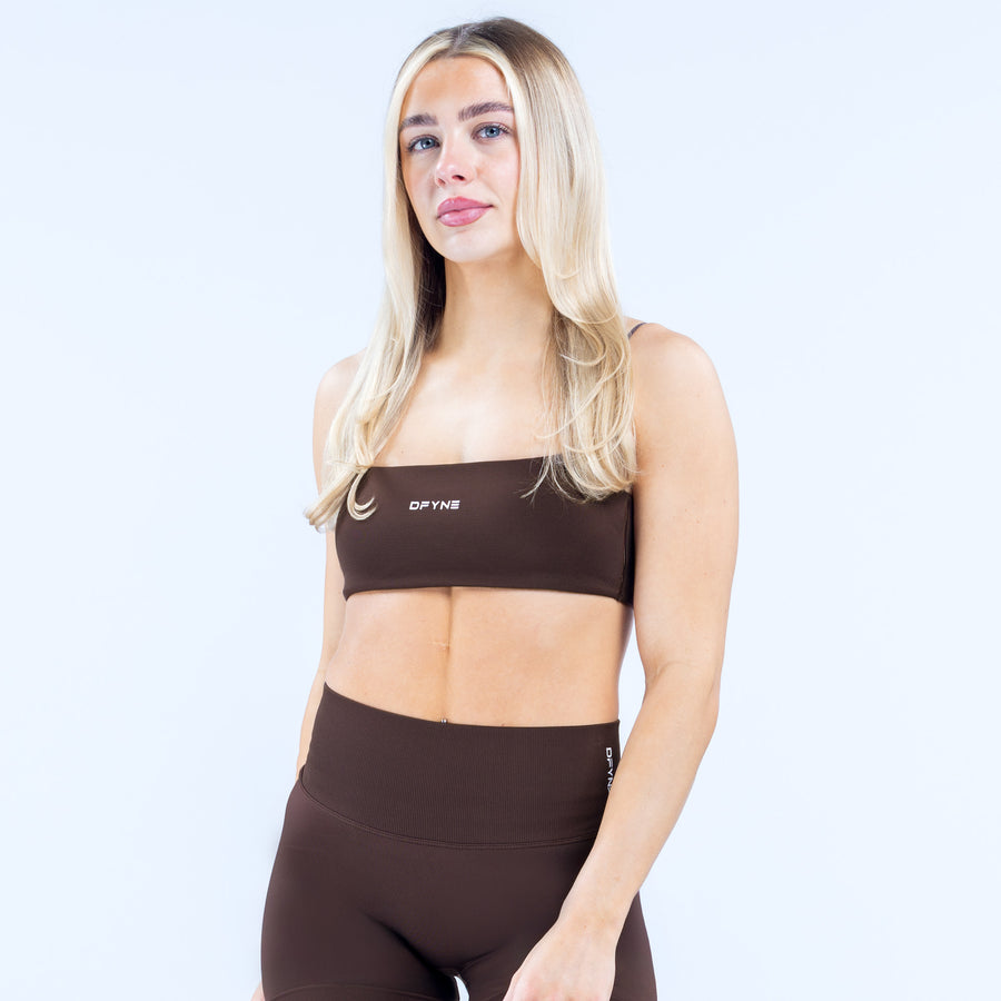 Black strappy bra front view with wide band and thin straps
