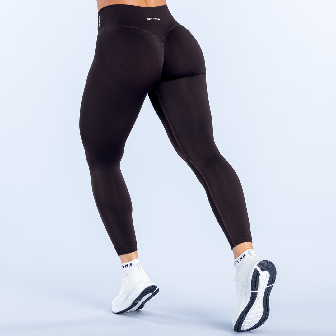 Defy leggings in black, back view with smooth high-waist fit to ankle