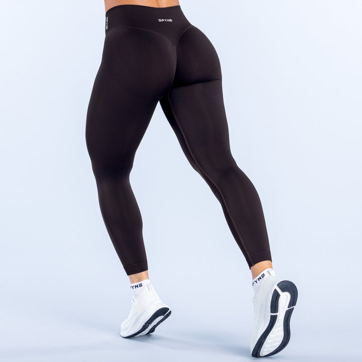 Defy leggings in black, back view with smooth high-waist fit to ankle