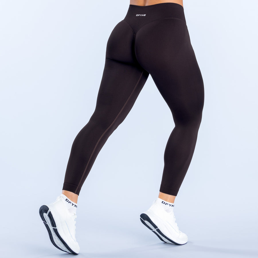 Black leggings with seamless curved back panel and ankle-length legs
