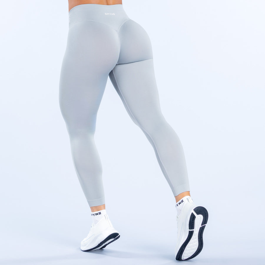 Light blue leggings back view with smooth stretch fabric and wide waistband