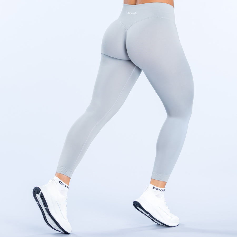 Light blue leggings back view with sculpted rear panel and ankle fit