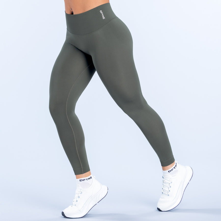 Dark green ankle-length leggings with waistband logo