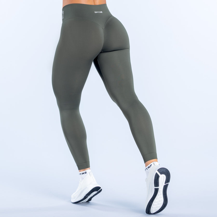 Dark green leggings with back seam and small logo at waistband
